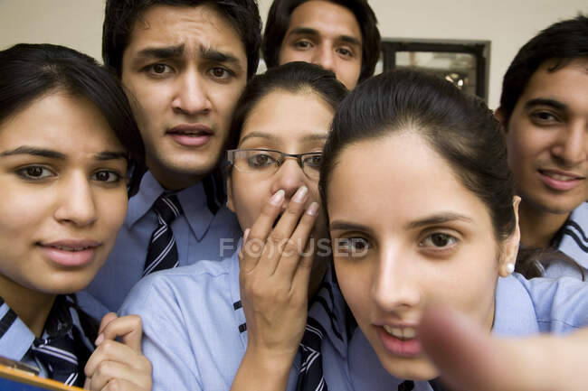 Close up portrait of confused students looking in camera — Stock Photo