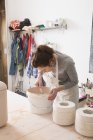 A ceramic artist is preparing the paste for slipcasting in a ceramic workshop. — Stock Photo