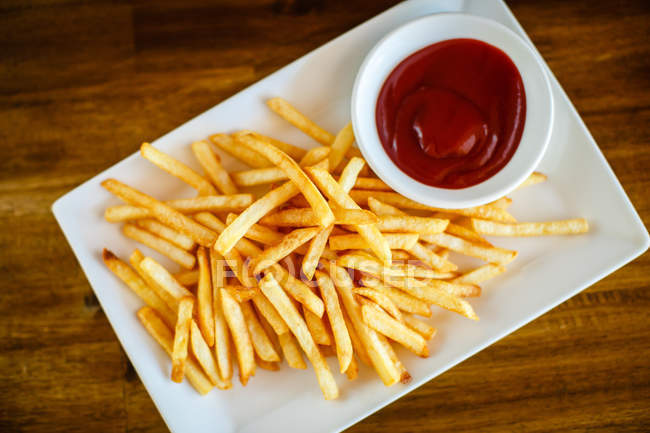 French fries with ketchup — Stock Photo