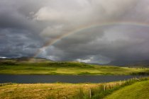 United Kingdom, Scotland, Highland, Portree, rainbow over Loch Snizort — Stock Photo