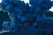 Indonesia, Maluku Utara, Kabupaten Halmahera Barat, density smoke clouds over active volcano Ibu on northern Molikken — Stock Photo