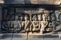 Indonesia, Java Tengah, Magelang, Pared en el Templo, Templo Budista, Templo de Borobudur - foto de stock