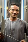Portrait of Egyptian man with knives in hands, Aswan, Aswan Government, Egypt — Stock Photo