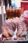 Cambodia, Kep, crabs market, spices in bottles and sachets on crabs market — Stock Photo