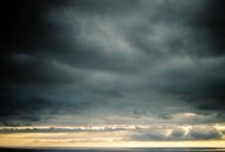 Greece, Makedonia Thraki, Potamia, Grey Clouds over stormy sea — Stock Photo