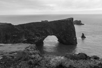 Black and white landscape view of rock arch at Snaefellsnes, Iceland — Stock Photo