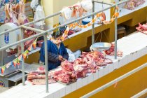 High angle view of meat seller in covered market of July city, Puno, Peru — Stock Photo