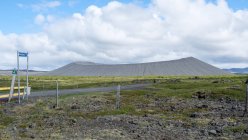 View of road with distant crater Hverfjall, Iceland — Stock Photo