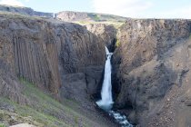 Scenic view of Litlanesfoss flowing from rocks — Stock Photo