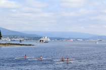 Canada, British Columbia, Vancouver, Stanley Park in Vancouver, rowers in boats on foreground — Stock Photo