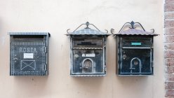 Italy, Umbria, Spello, mail boxes hanging on wall in old town Spello — Stock Photo