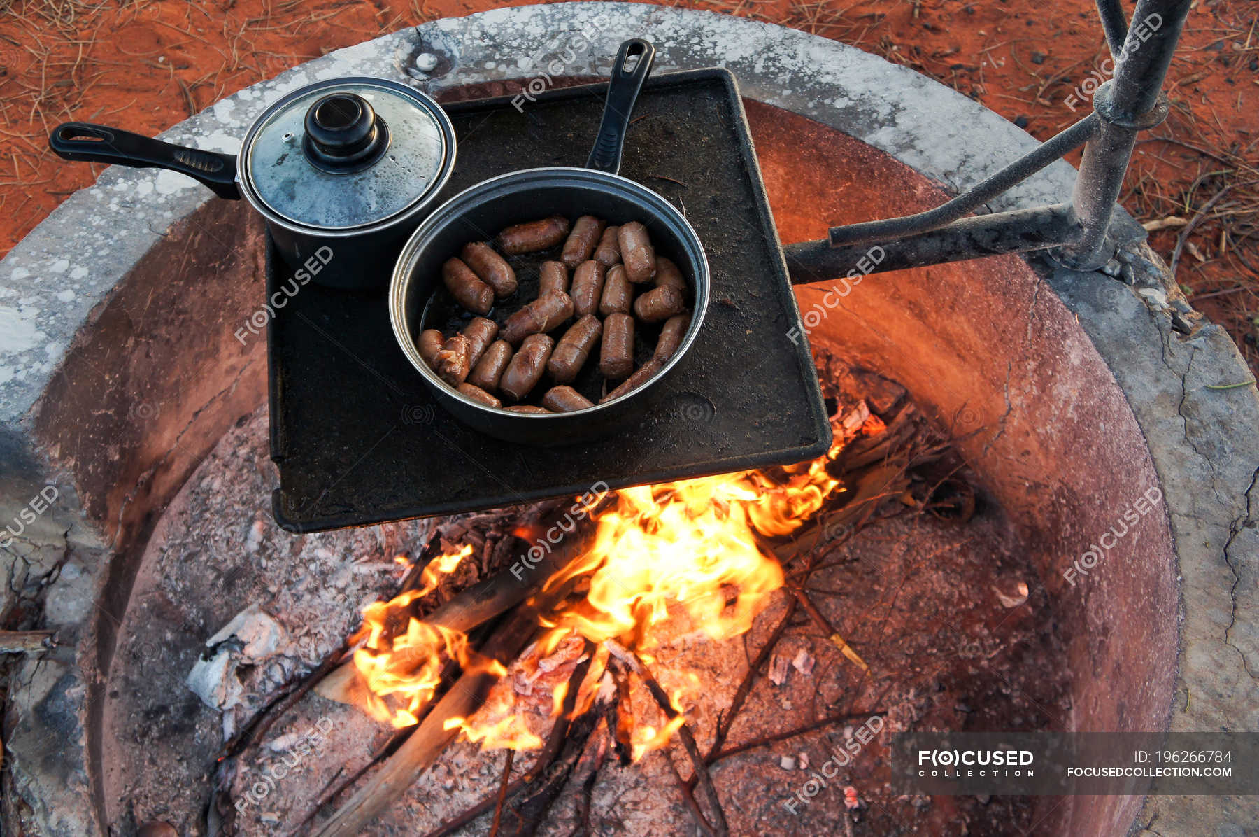 Grilled Sausages Above Outdoor Fireplace Australia Barbecue