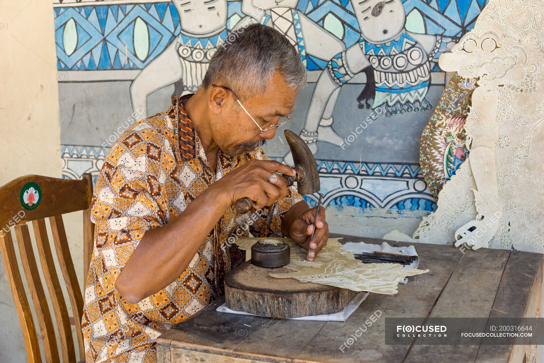 Indonesia, Java, Yogyakarta, batik artist on grounds of water castle ...