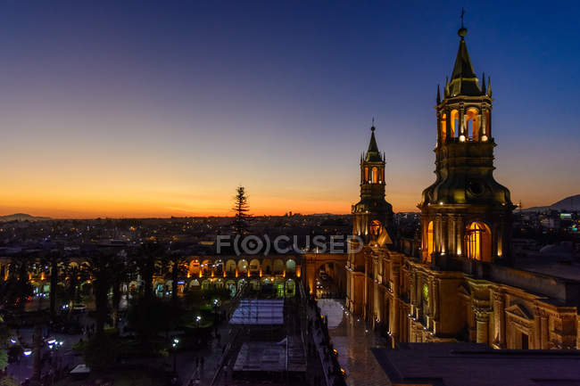 Peru, Arequipa, View of the cathedral of Arequipa from a roof terrace restaurant illuminated at night — Stock Photo