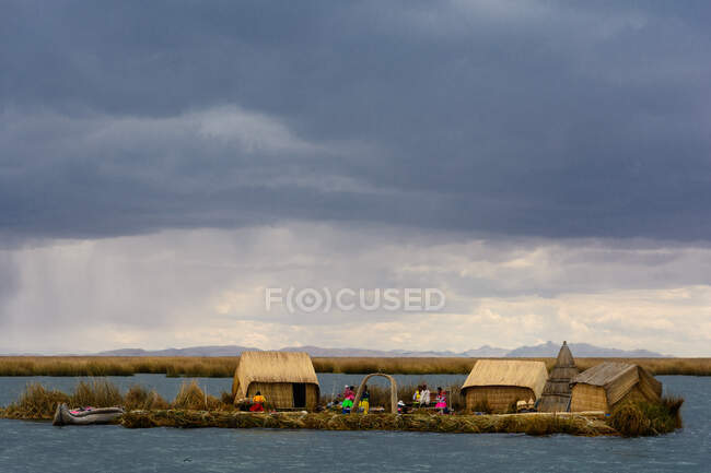 Settlement on Uros floating island of reed on lake, Puno, Peru — Stock Photo