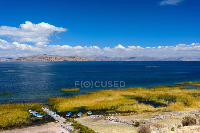 Peru, Puno, boats at lake by Uros, scenic aerial landscape — Stock Photo