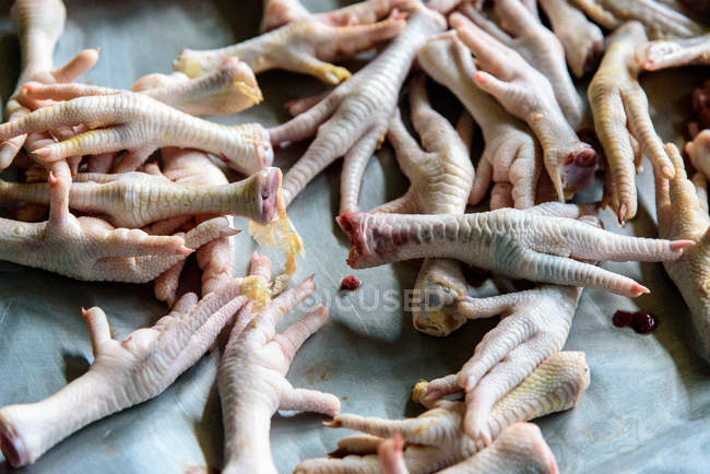 Chicken feet on stand of market in Yogyakarta, Java, Indonesia, Asia — Stock Photo