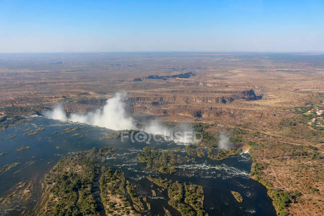 Zambia, Victoria Falls, Sambesi river, aerial view from helicopter at the transition to the Victoria Falls from above — Stock Photo