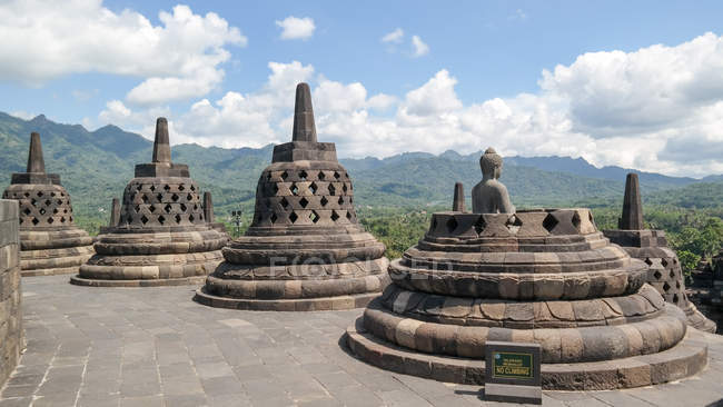 Indonesia, Jawa Tengah, Magelang, Buddhist Temple Borobudur in Central  Java, mountain landscape on the background — structure, grave mound - Stock  Photo | #199826328