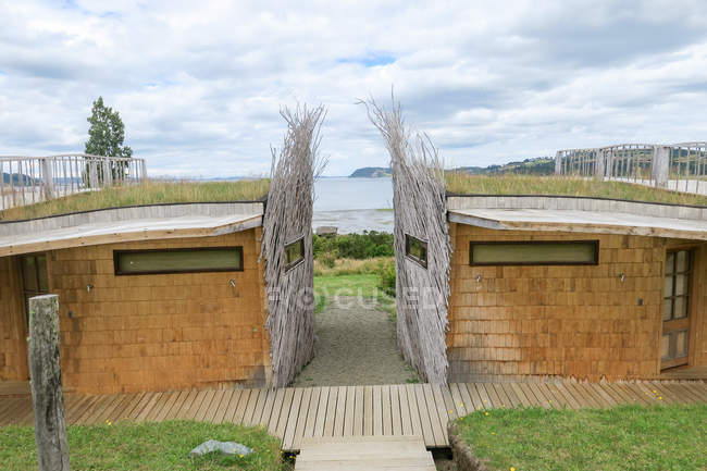 View of two beach shower bathes against sea, Chile — Stock Photo