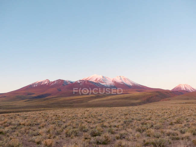Chile, Region de Antofagasta, El Loa, San Pedro de Atacama, mountain panorama at sunset — стокове фото