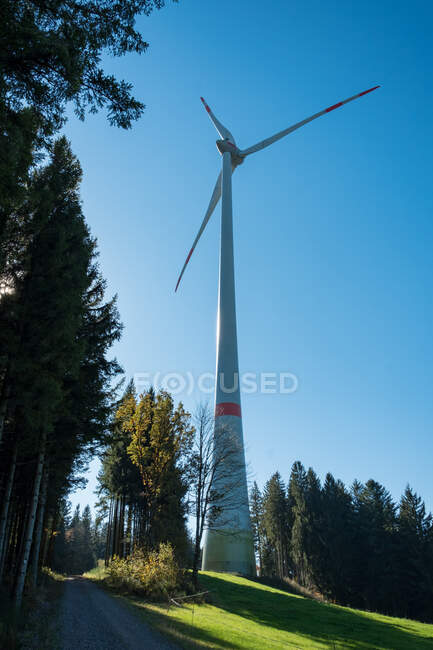 Germany, Baden-Wurttemberg, Gutach, Black Forest Railway, Westweg, low angle of wind mill in countryside. — Stock Photo