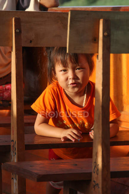 Laos, front view of girl on boat on Mekong river — Stock Photo