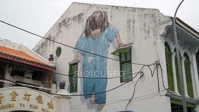 Малайзія, дитина Пантай Пінанг, Джорджтаун, живопис на стіні будинку в Пенанг — стокове фото
