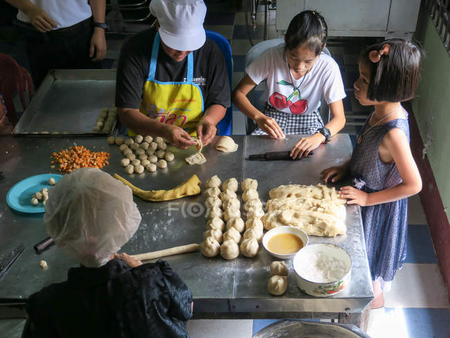 People working with dough in Chinese Bakery, Khao Lak, Thailand — Stock Photo