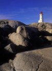 Iconic Peggy Cove lighthouse on granite shoreline of Nova Scotia, Canada. — Stock Photo