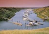 Docked boats at Lake Diefenbaker, Elbow Harbour, Elbow, Saskatchewan, Canada — Stock Photo