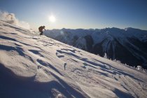 A backcountry skier skis through windslab in the  Kicking Horse Backcountry, Golden, Britsh Columbia, Canada — Stock Photo