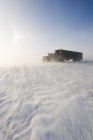 Truck riding on road covered with blowing snow near Morris, Manitoba, Canada — Stock Photo