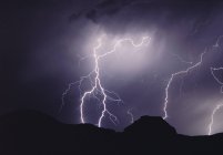 Lightning storm at night over Castle Butte, Big Muddy Badlands, Saskatchewan, Canada — Stock Photo