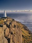 Lighthouse on cliff at Cape Spear National Historic Site, Newfoundland, Canada — Stock Photo