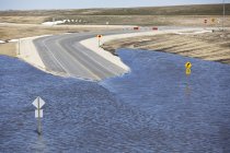 Spring flooding of Red River on highway, Red River Valley, Winnipeg, Manitoba, Canada — Stock Photo