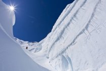 Backcountry skier touring up crevassed glacier at Icefall Lodge, Golden, British Columbia, Canada — Stock Photo
