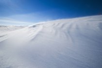 Windswept snow drifts on hillside in Big Muddy Valley, Saskatchewan, Canada — Stock Photo