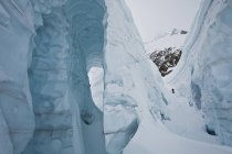 Male backcountry skier walking through glacier at Icefall Lodge, Golden, British Columbia, Canada — Stock Photo