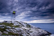 Lighthouse at Peggy Cove during approaching storm, Nova Scotia, Canada. — Stock Photo