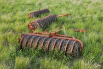 Close-up of abandoned farm equipment in field — Stock Photo