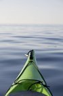 Bow of kayak boat heading out in calm water at South Coast, Newfoundland, Canada — Stock Photo