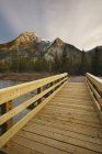 Wooden boardwalk to Mount Lorette over Mount Lorette Pond, Kananaskis Country, Alberta, Canada — Stock Photo