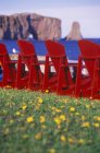 Perce Rock with colorful lawn chairs, Gaspe Peninsula, Quebec, Canada. — Stock Photo
