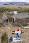High angle view of local residents of floating reed island of Uros, Lake Titicaca, Peru — Stock Photo