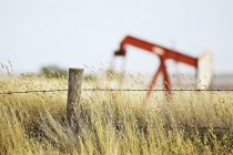 Prairie landscape with oil pump jack at Gull Lake, Saskatchewan, Canada. — Stock Photo