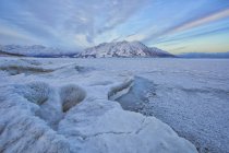 Partially ice covered lake and Sheep Mountain in Kluane national Park, Yukon, Canada. — Stock Photo