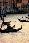 Gondolas carrying tourists on Grand Canal in Venice, Italy — Stock Photo