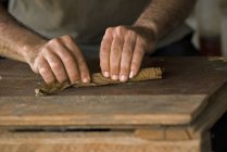 Close-up of male hands rolling cigar in Vinales, Cuba — Stock Photo