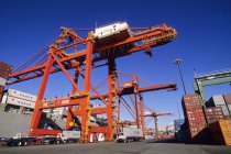 Terminal with dock crane unloading container ship, Port of Vancouver, British Columbia, Canada. — Stock Photo